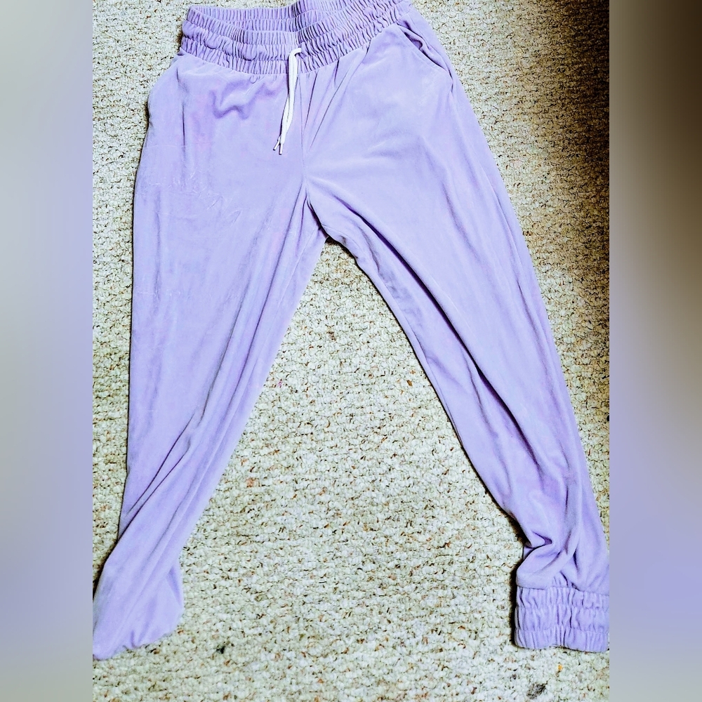 Purple track pants.